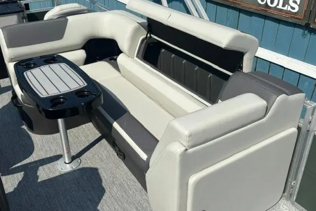 Slide: The Image of 2026 Sun Tracker Fishin' Barge 22 DLX interior with seating and table. - 15