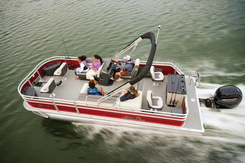 Slide: The Image of Manufacturer Provided Image: 2026 Sun Tracker Fishin' Barge 22 DLX cruising on water with passengers onboard. - 27