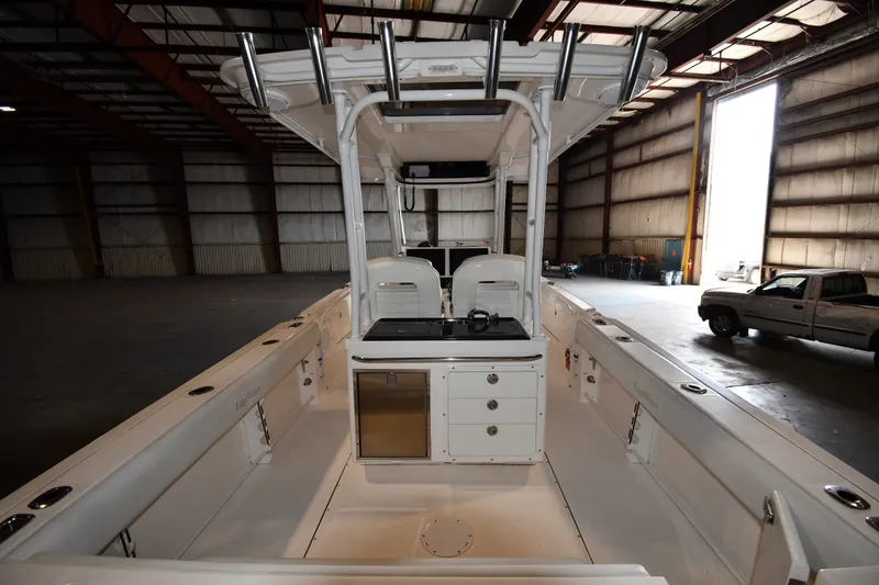 Slide: The Image of 2015 Edgewater 320CC boat interior in a warehouse setting. - 29