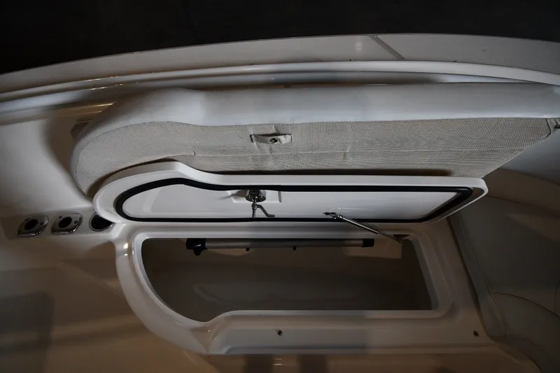 Slide: The Image of Open storage compartment on a 2015 Edgewater 320CC boat, showcasing interior space. - 34
