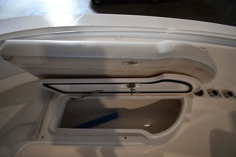 Slide: The Image of Open storage compartment on a 2015 Edgewater 320CC boat, showcasing interior space. - 35