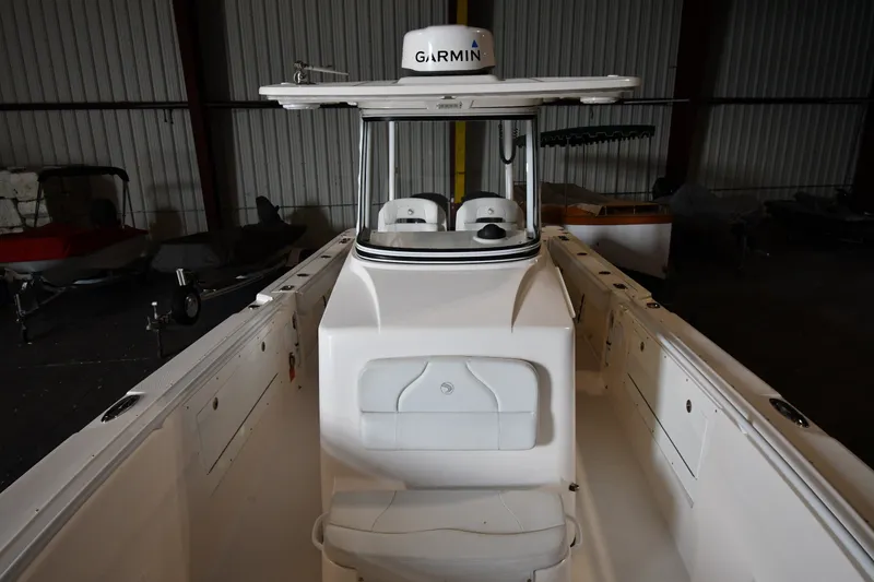 Slide: The Image of 2015 Edgewater 320CC boat interior with Garmin equipment in a storage facility. - 28