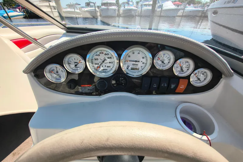 Slide: The Image of Dashboard of a 2004 Stingray 185 LS/LX boat with gauges and controls. - 7