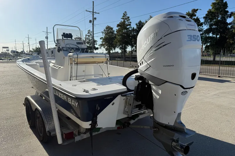 Slide: The Image of 2005 Blazer Bay 2220 Fisherman boat with Mercury 350 outboard engine on trailer. - 4