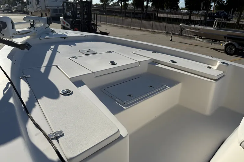 Slide: The Image of 2005 Blazer Bay 2220 Fisherman boat deck with storage compartments and fishing equipment. - 14