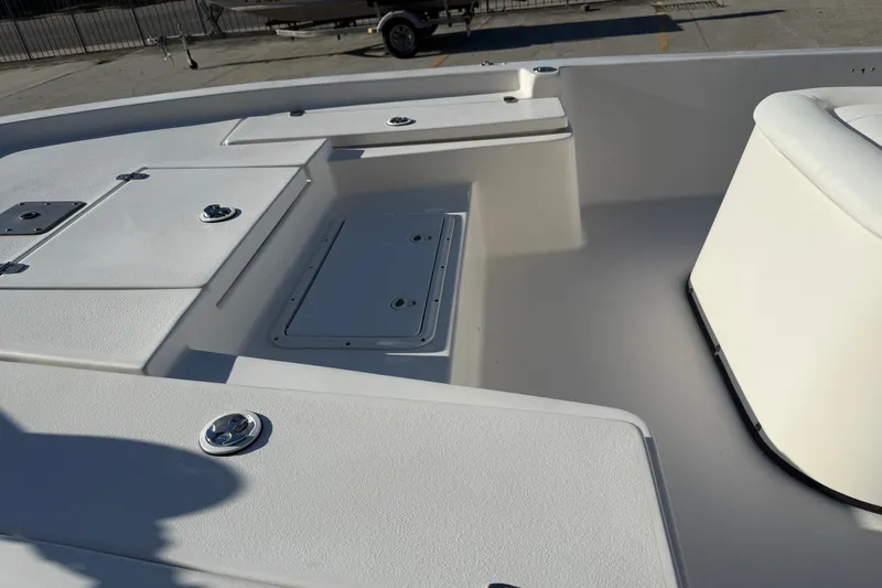 Slide: The Image of 2005 Blazer Bay 2220 Fisherman boat deck with storage compartments and seating. - 15