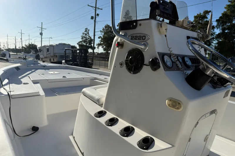 Slide: The Image of 2005 Blazer Bay 2220 Fisherman boat interior with steering console and seating. - 12