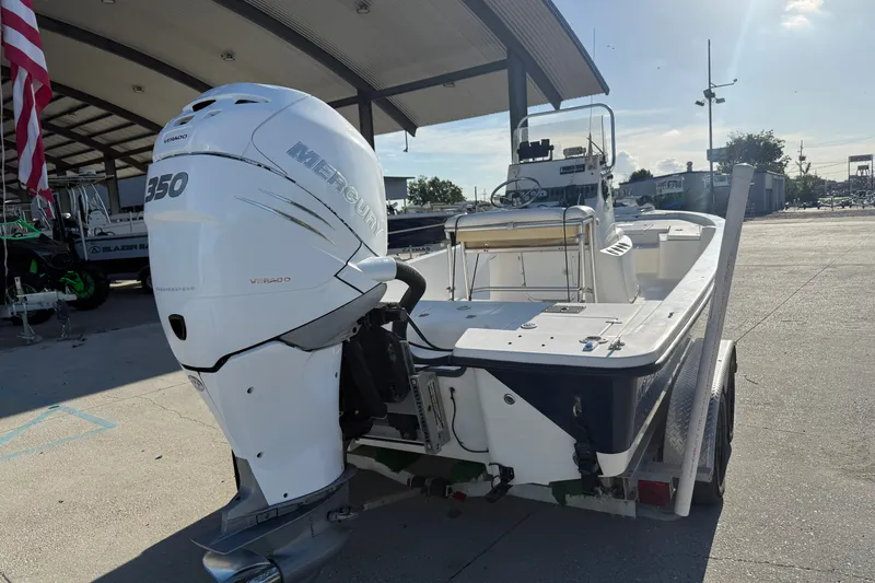 Slide: The Image of 2005 Blazer Bay 2220 Fisherman boat with Mercury 350 engine at a marina. - 3