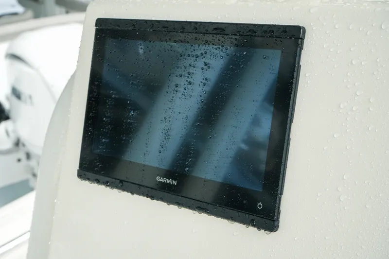 Slide: The Image of Garmin display on 2022 Key West 219 FS boat, covered in water droplets. - 32