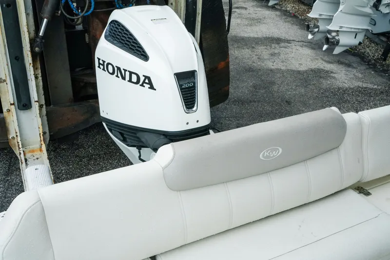 Slide: The Image of 2022 Key West 219 FS boat with Honda 200 outboard motor, rear seating view. - 36