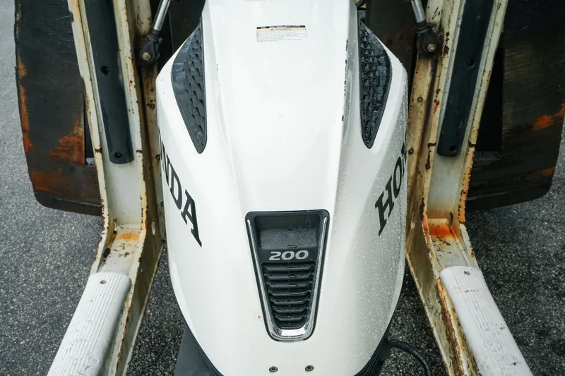 Slide: The Image of Close-up of a Honda 200 outboard motor on a 2022 Key West 219 FS boat. - 37