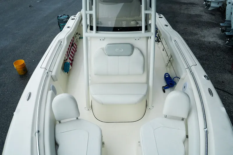 Slide: The Image of 2022 Key West 219 FS boat interior with white seating and clean deck. - 17