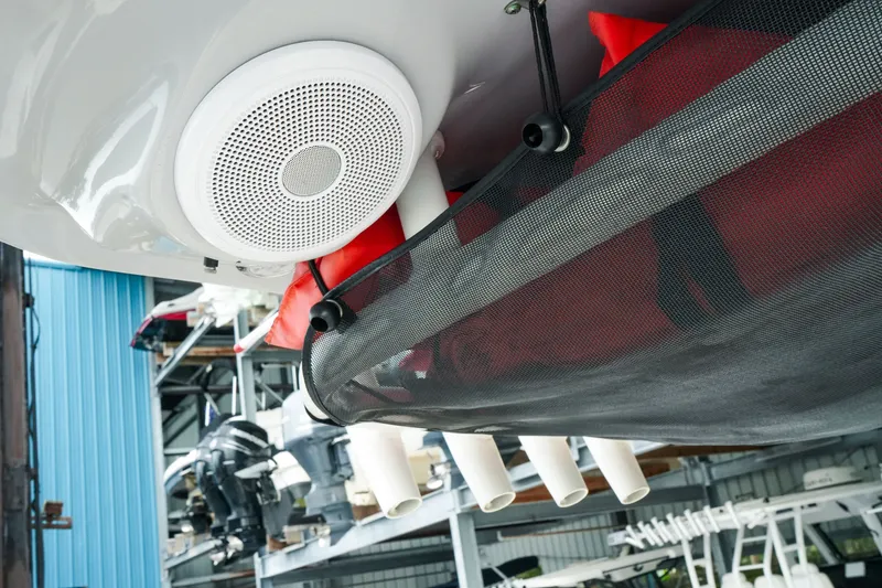Slide: The Image of 2022 Key West 219 FS boat speaker and storage net detail in a marina. - 35