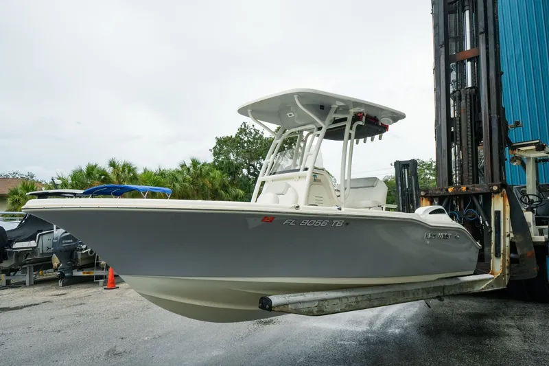 Slide: The Image of 2022 Key West 219 FS boat on forklift, outdoor storage area. - 42
