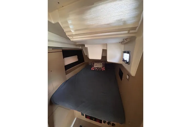 Slide: The Image of Interior cabin of 2020 Beneteau Oceanis 461 yacht with cozy bed and window. - 12