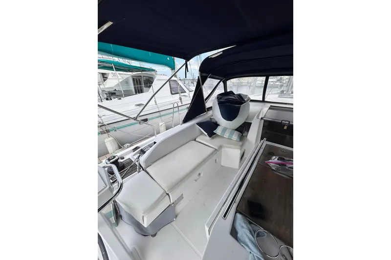 Slide: The Image of Interior view of 2010 Oceanis 46.1 sailboat cockpit with seating and canopy. - 3