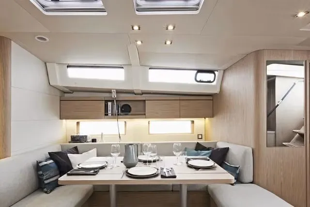 Slide: The Image of Luxurious Oceanis 46.1 yacht interior dining area with elegant table setting, 2010 model. - 11