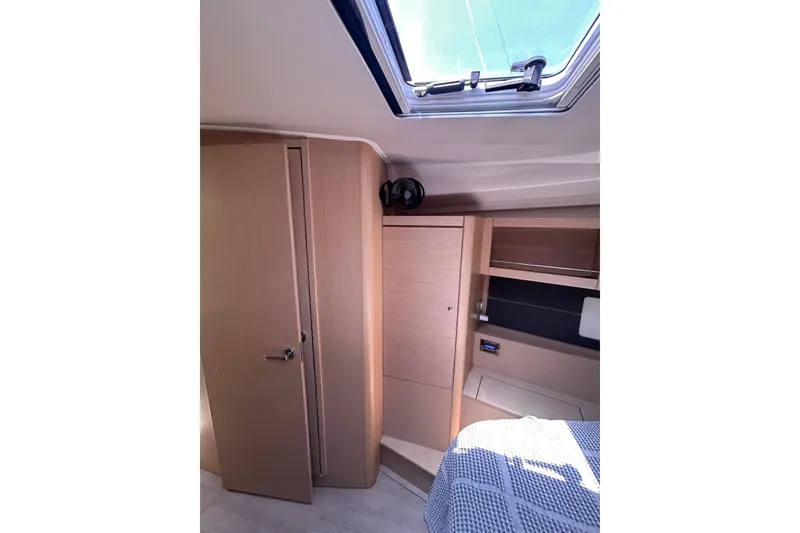 Slide: The Image of Interior cabin of 2020 Beneteau Oceanis 461 yacht with wooden finish and skylight. - 17