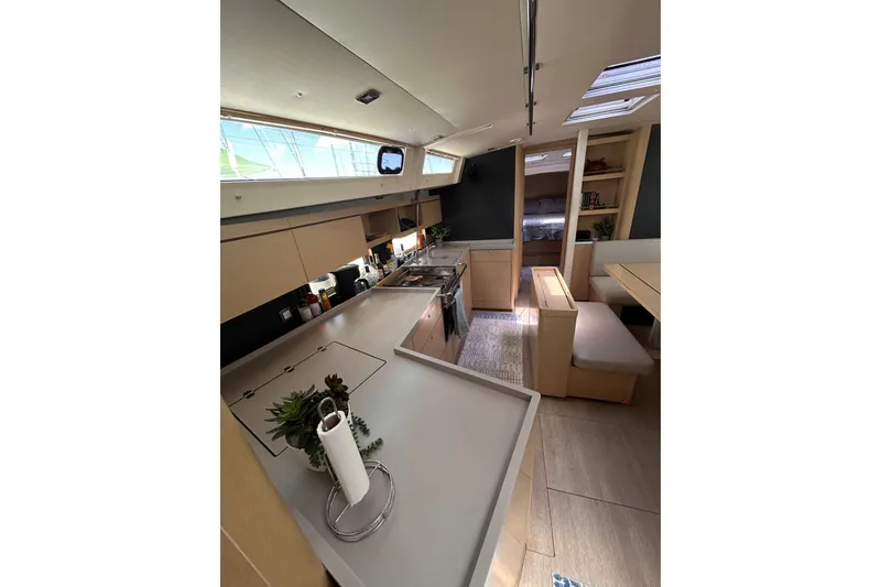 Slide: The Image of Modern interior of 2020 Beneteau Oceanis 461 yacht with spacious kitchen and seating area. - 20