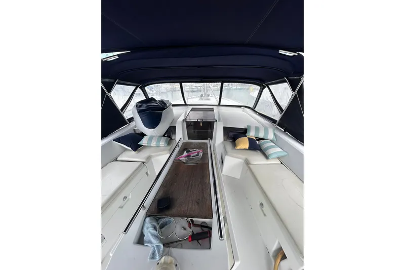 Slide: The Image of Interior view of 2010 Oceanis 46.1 sailboat cockpit with cushions and canopy. - 4