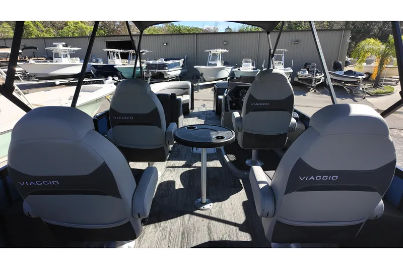 Slide: The Image of Interior of 2025 Viaggio Z24Q boat with four seats and a small table. - 4