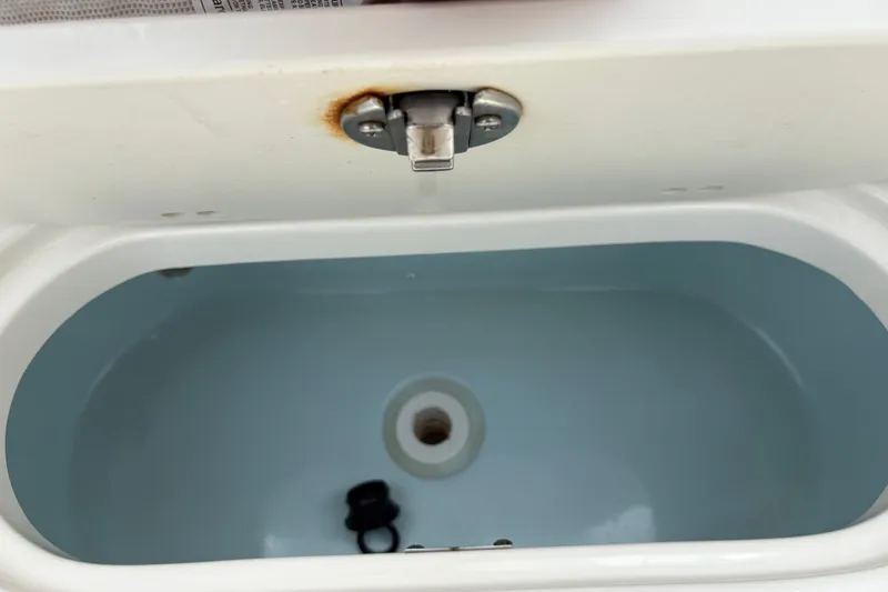 Slide: The Image of Open compartment of 2025 Key West 239 FS boat, showing interior details. - 25
