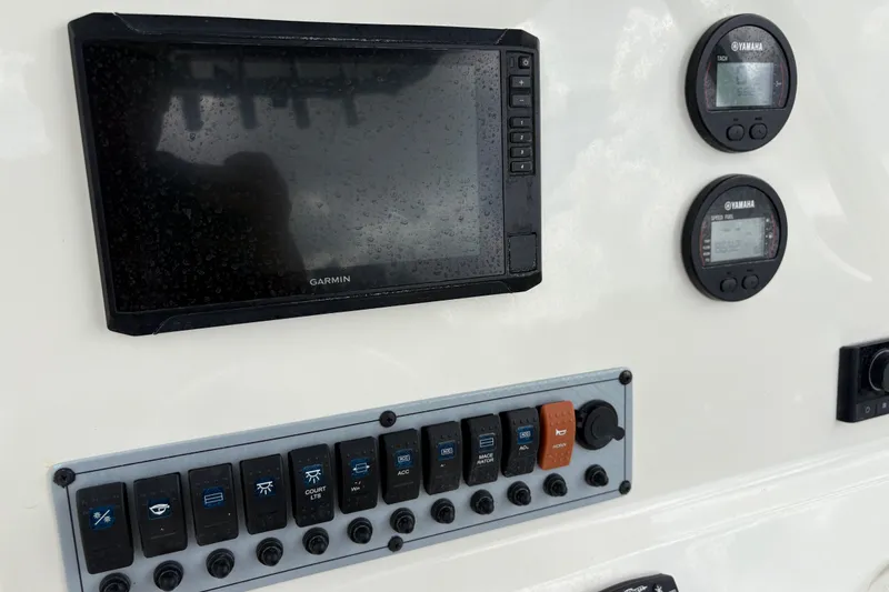Slide: The Image of Dashboard of 2025 Key West 239 FS boat with Garmin display and Yamaha gauges. - 19