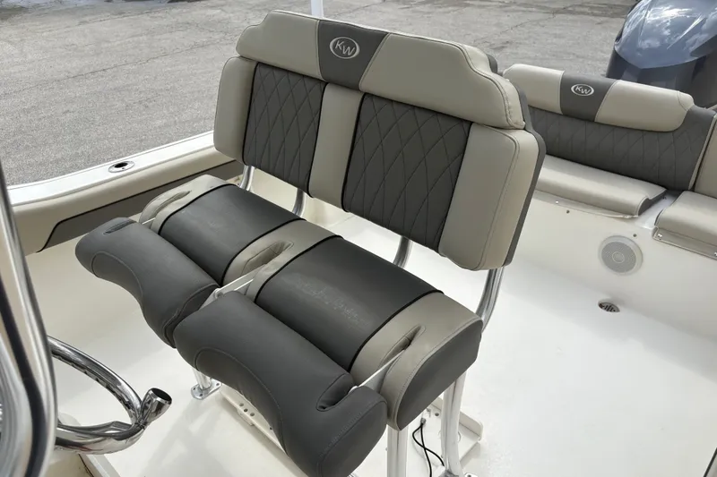 Slide: The Image of 2025 Key West 239 FS boat seating with cushioned, dual-tone design and stainless steel frame. - 22