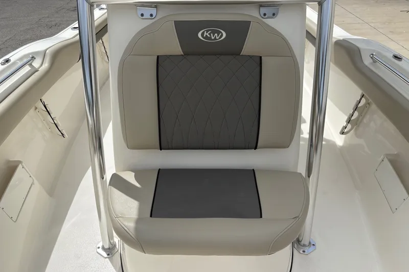 Slide: The Image of 2025 Key West 239 FS boat seat with beige and gray upholstery. - 18