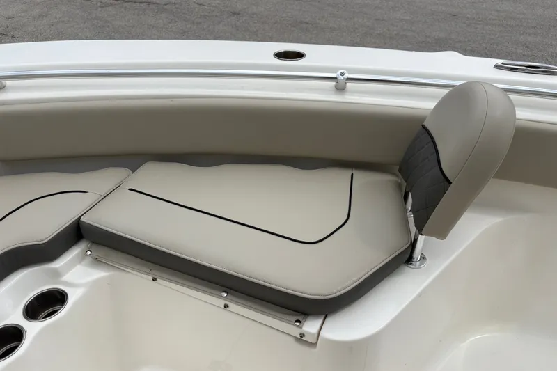 Slide: The Image of 2025 Key West 239 FS boat interior with beige seating and cup holders. - 16