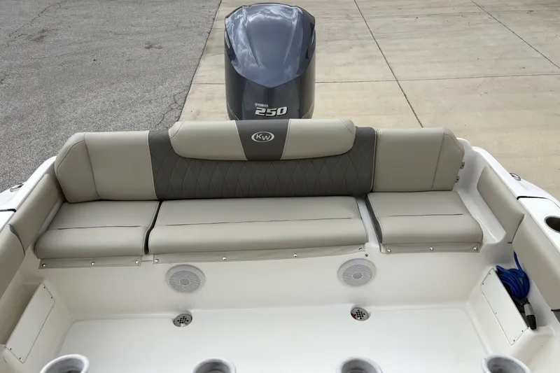 Slide: The Image of 2025 Key West 239 FS boat with Yamaha 250 engine, featuring comfortable rear seating. - 24
