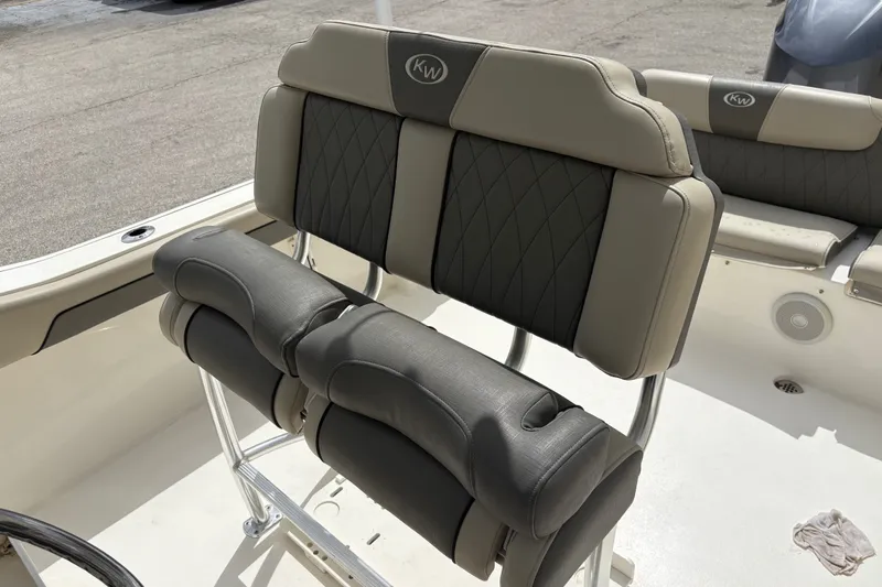Slide: The Image of 2025 Key West 239 FS boat seating with cushioned backrests and sleek design. - 21
