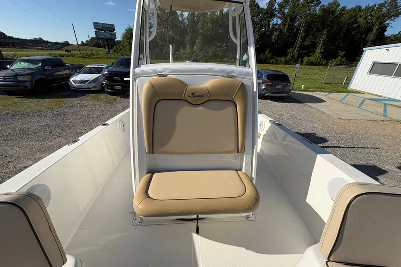 Slide: The Image of 2018 Scout 251 XSS boat interior with tan seating and white deck. - 17