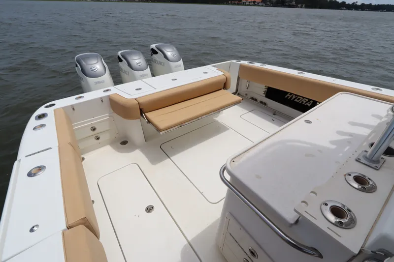Slide: The Image of 2009 Hydra-Sports 4100 VSF boat with Suzuki engines, spacious deck, and comfortable seating. - 16