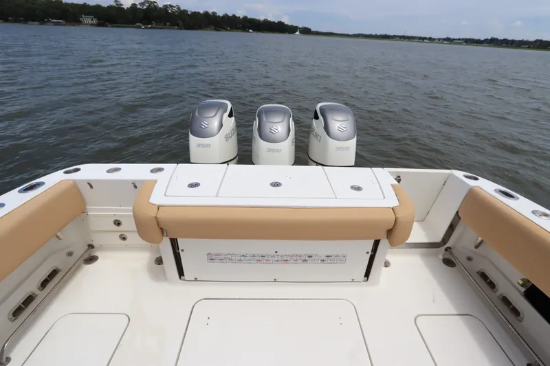 Slide: The Image of 2009 Hydra-Sports 4100 VSF boat with triple Suzuki 350 engines on a calm lake. - 10