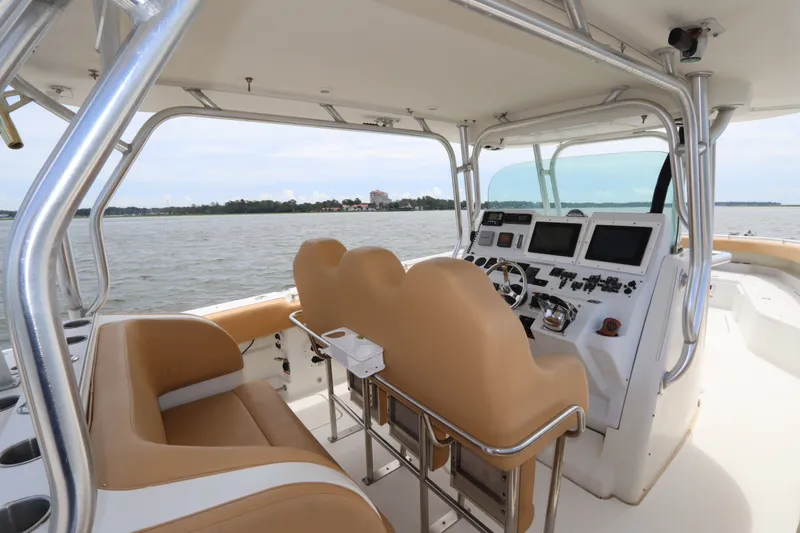 Slide: The Image of Interior view of 2009 Hydra-Sports 4100 VSF boat with tan seating and control panel. - 32