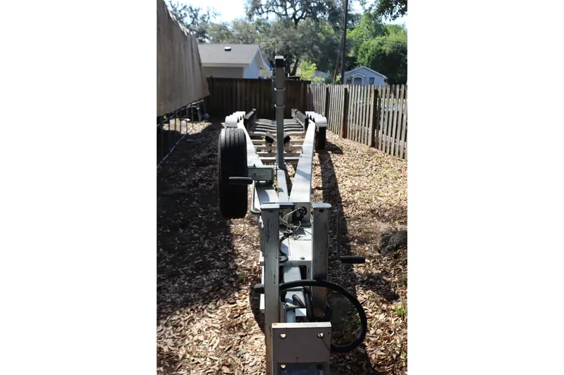 Slide: The Image of Trailer for 2009 Hydra-Sports 4100 VSF boat parked in a yard. - 70