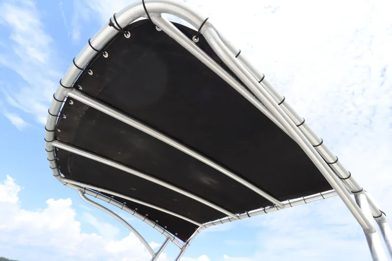 Slide: The Image of Bimini top of 2009 Hydra-Sports 4100 VSF boat against a clear sky. - 24