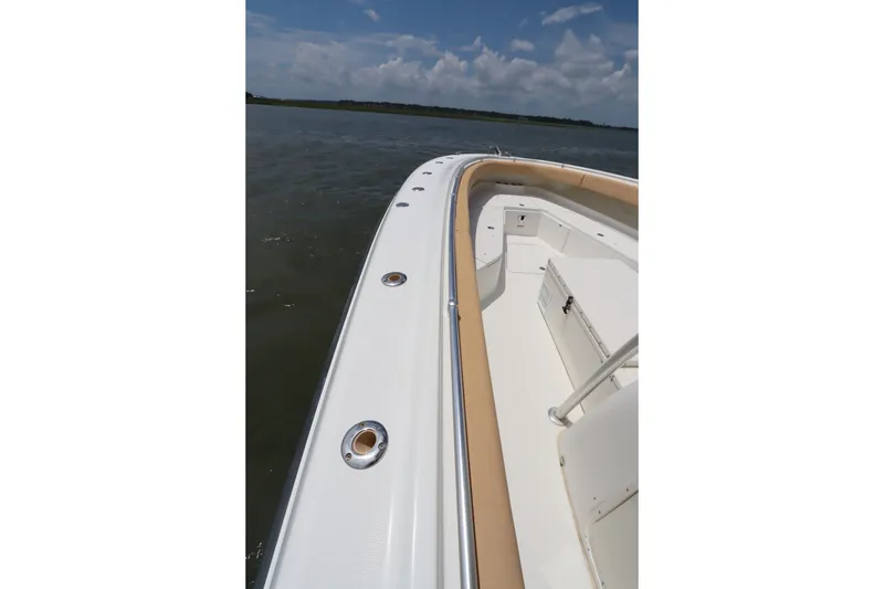Slide: The Image of 2009 Hydra-Sports 4100 VSF boat deck with sleek design on open water. - 47