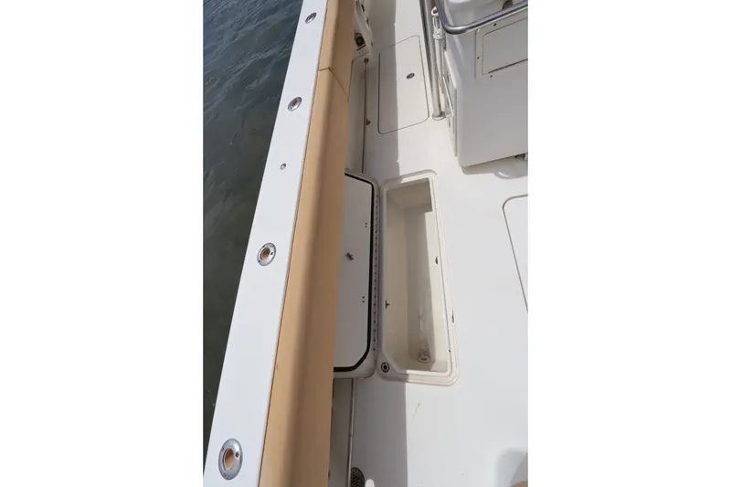 Slide: The Image of 2009 Hydra-Sports 4100 VSF boat deck with storage compartments and seating. - 55