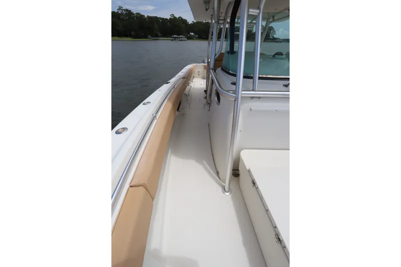 Slide: The Image of 2009 Hydra-Sports 4100 VSF boat deck with beige seating and railing. - 60