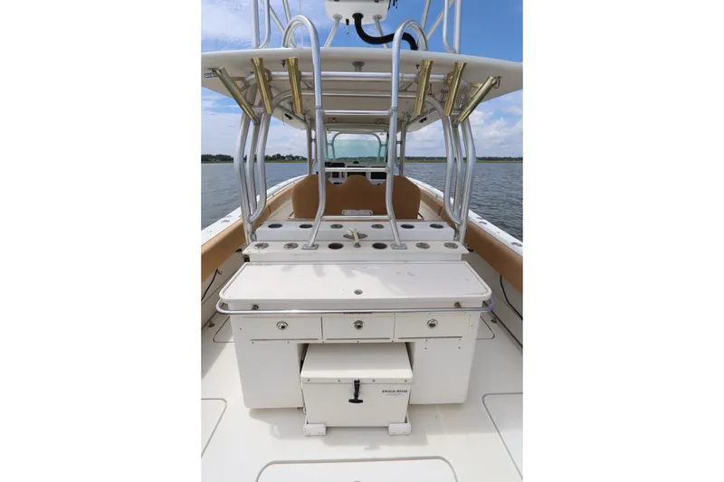 Slide: The Image of 2009 Hydra-Sports 4100 VSF boat interior with fishing rod holders and storage compartments. - 20
