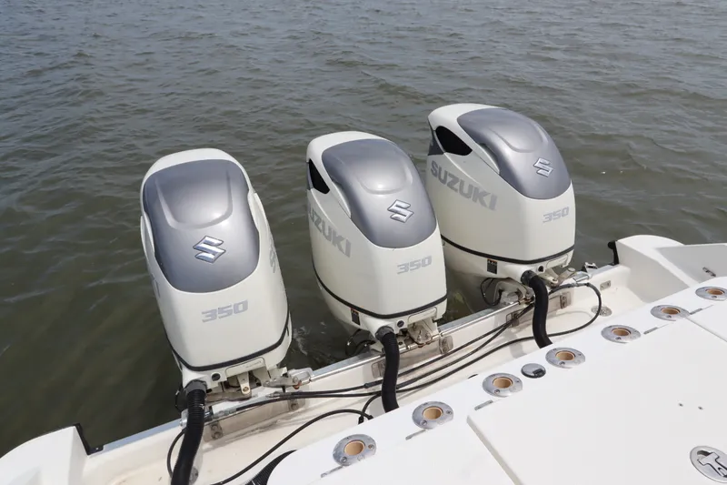 Slide: The Image of Triple Suzuki 350 outboard engines on a 2009 Hydra-Sports 4100 VSF boat. - 11