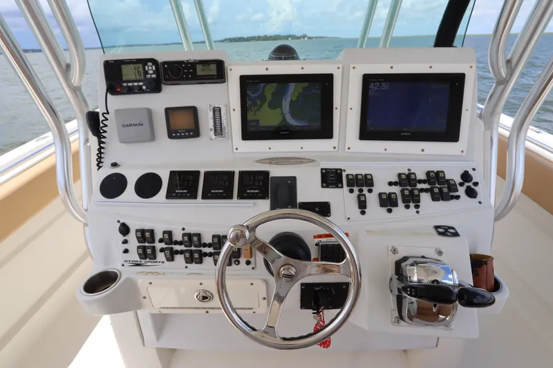 Slide: The Image of 2009 Hydra-Sports 4100 VSF boat dashboard with navigation screens and controls. - 37