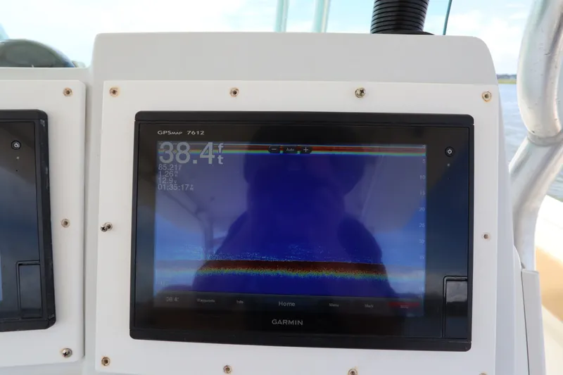 Slide: The Image of Garmin GPSMAP 7612 display on 2009 Hydra-Sports 4100 VSF boat, showing depth and sonar data. - 41