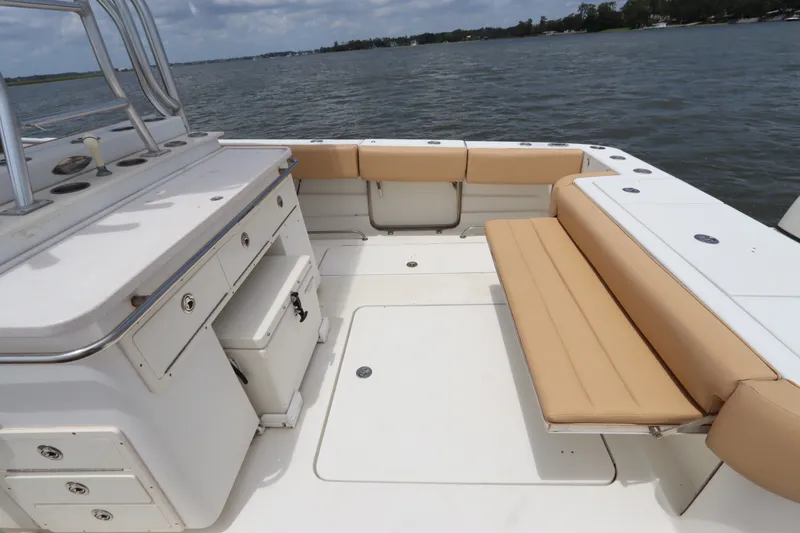 Slide: The Image of 2009 Hydra-Sports 4100 VSF boat interior with beige seating and storage compartments. - 18