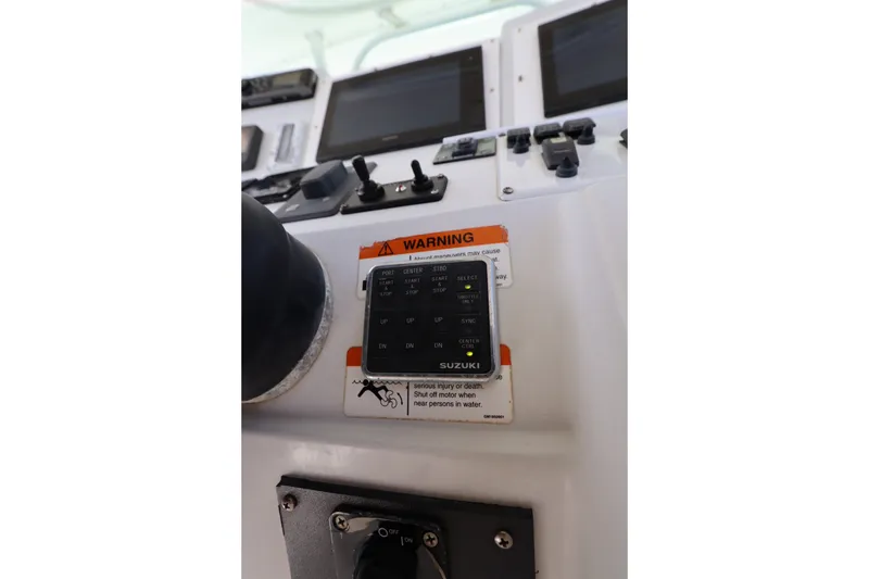 Slide: The Image of Control panel of a 2009 Hydra-Sports 4100 VSF boat with warning label and switches. - 45