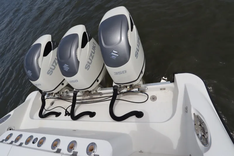 Slide: The Image of Triple Suzuki 350 outboard engines on a 2009 Hydra-Sports 4100 VSF boat. - 12