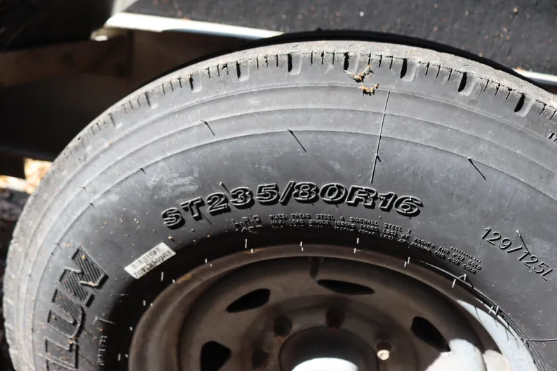 Slide: The Image of Close-up of a tire on a 2009 Hydra-Sports 4100 VSF boat trailer. - 75