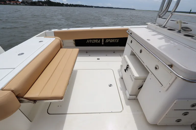 Slide: The Image of 2009 Hydra-Sports 4100 VSF boat interior with tan seating and storage compartments. - 17